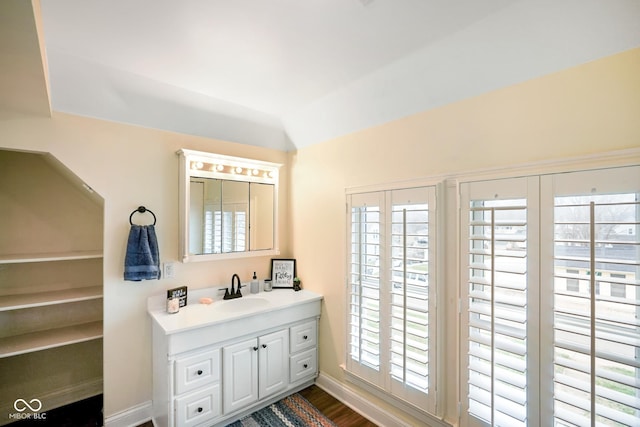 232 N Church St, Morgantown, IN 46160 - bathroom with baseboards, vanity, and wood finished floors
