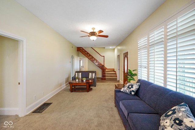 232 N Church St, Morgantown, IN 46160 - carpeted living room with stairway, visible vents, baseboards, and ceiling fan