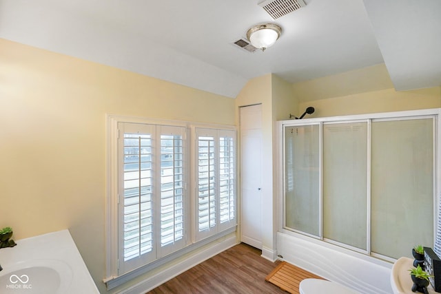232 N Church St, Morgantown, IN 46160 - bathroom with shower / bath combination with glass door, wood finished floors, visible vents, and plenty of natural light
