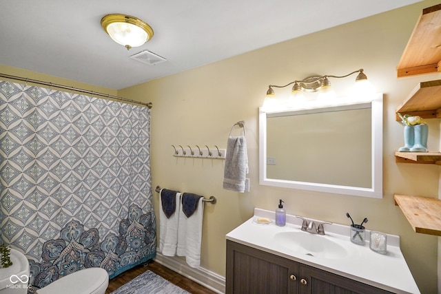 232 N Church St, Morgantown, IN 46160 - bathroom with a shower with curtain, toilet, visible vents, wood finished floors, and vanity