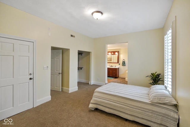 232 N Church St, Morgantown, IN 46160 - bedroom with baseboards, ensuite bath, visible vents, and light colored carpet