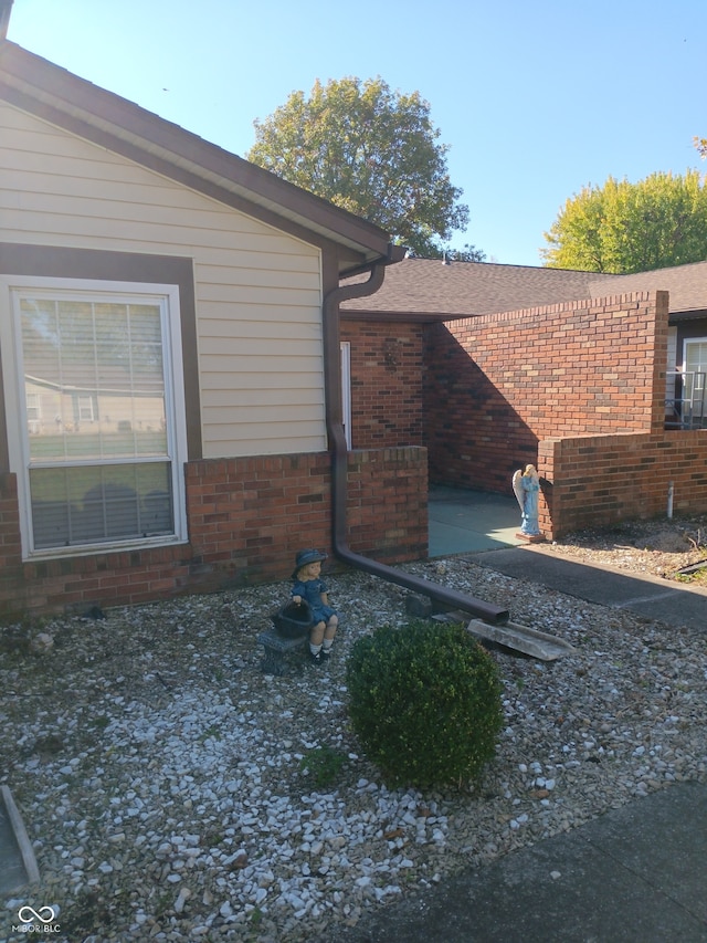 view of side of property featuring a patio area