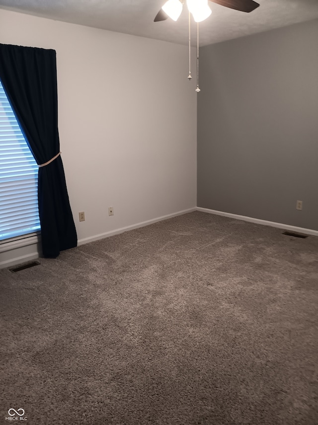 carpeted empty room with ceiling fan