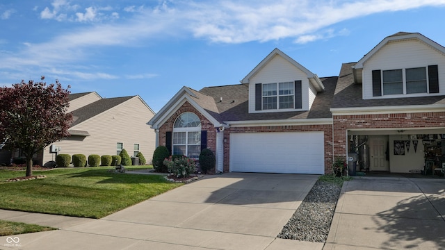 view of front of property featuring a front yard and a garage