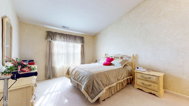 carpeted bedroom featuring vaulted ceiling