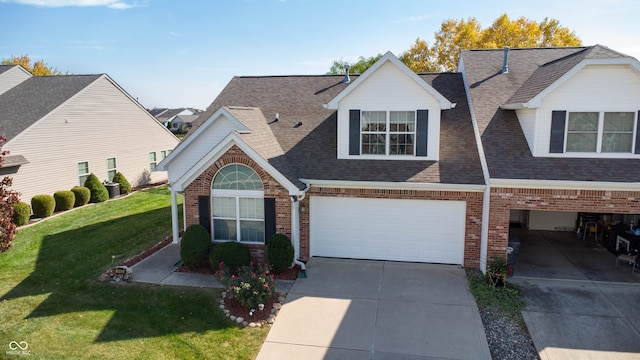 view of front of home featuring a garage and a front lawn