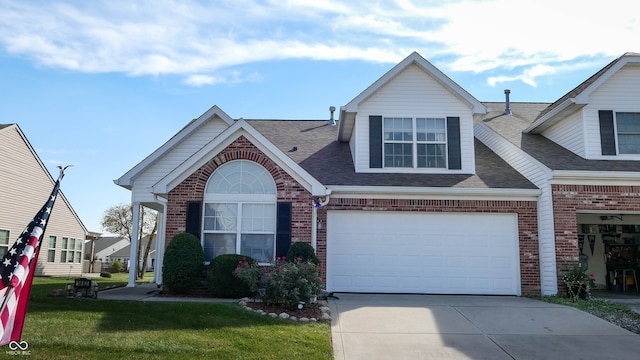 view of front of home featuring a garage and a front lawn