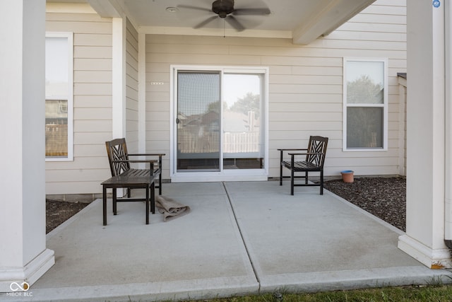 view of patio featuring ceiling fan