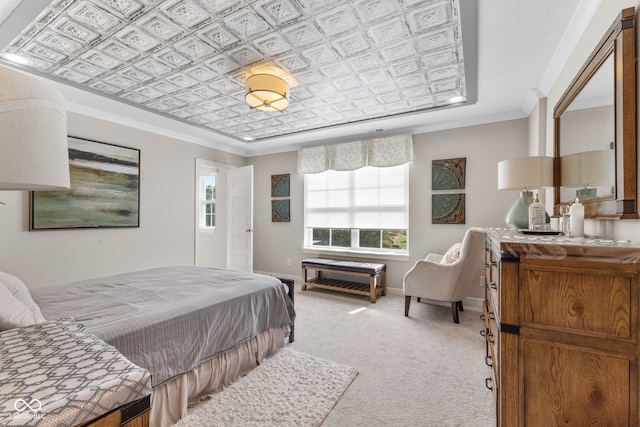 carpeted bedroom featuring crown molding