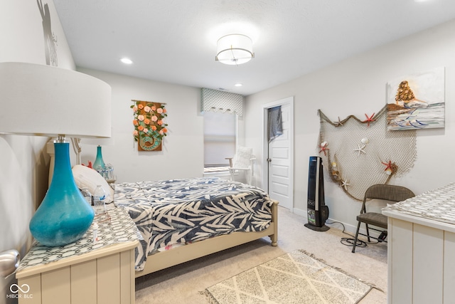 bedroom with light colored carpet