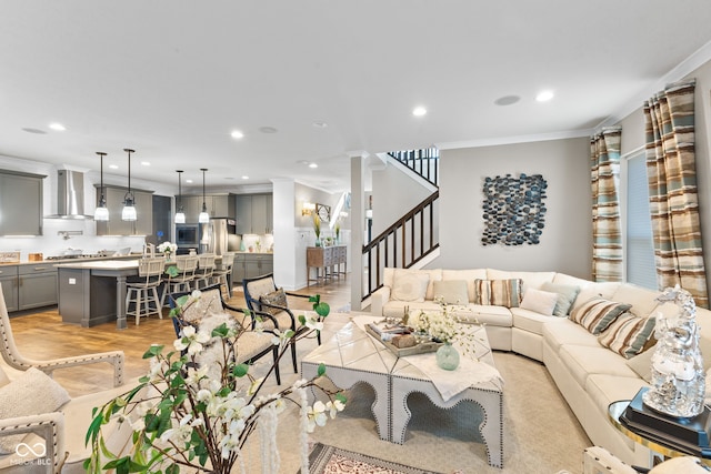 living room featuring light hardwood / wood-style floors and ornamental molding