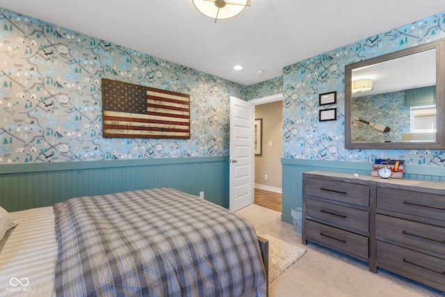 bedroom featuring wooden walls