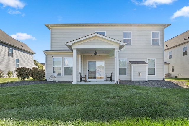 rear view of house with a patio, a lawn, central AC unit, and ceiling fan