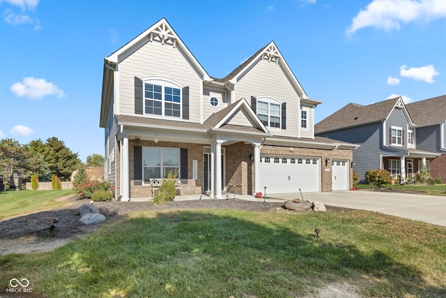 craftsman-style home with a porch, a front yard, and a garage