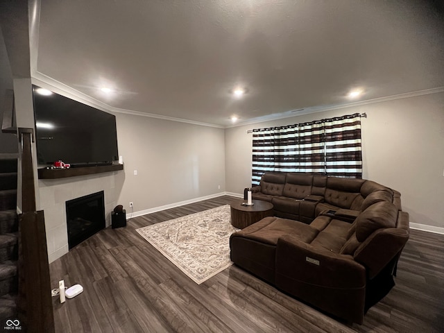 living room with crown molding and dark hardwood / wood-style flooring