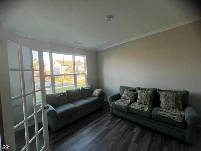 living room featuring crown molding and hardwood / wood-style flooring