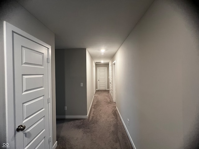 hall with dark carpet