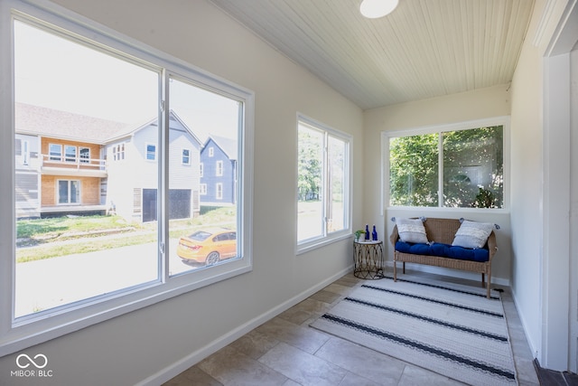 sunroom featuring wood ceiling