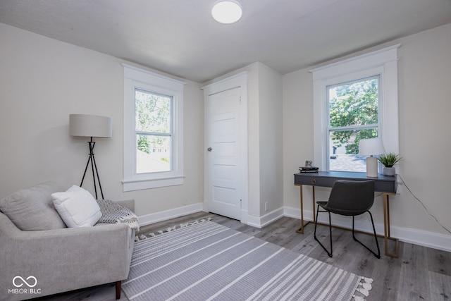 home office featuring hardwood / wood-style floors and a healthy amount of sunlight