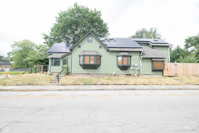 bungalow-style house with solar panels