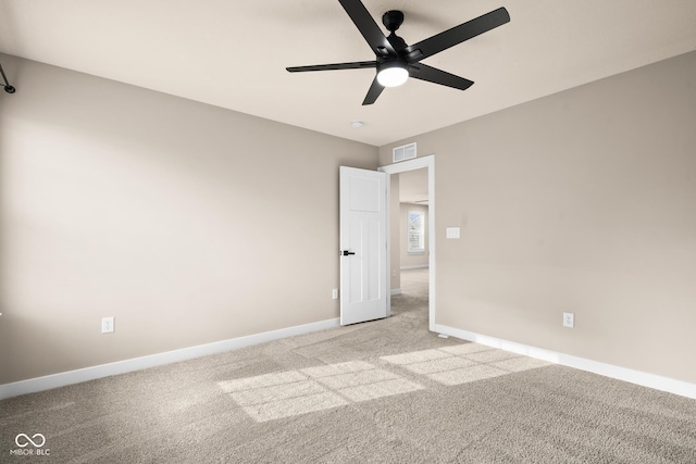 unfurnished bedroom featuring ceiling fan and light colored carpet