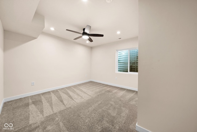 carpeted empty room with ceiling fan