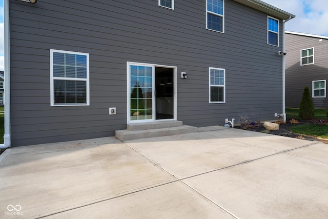 rear view of house with a patio