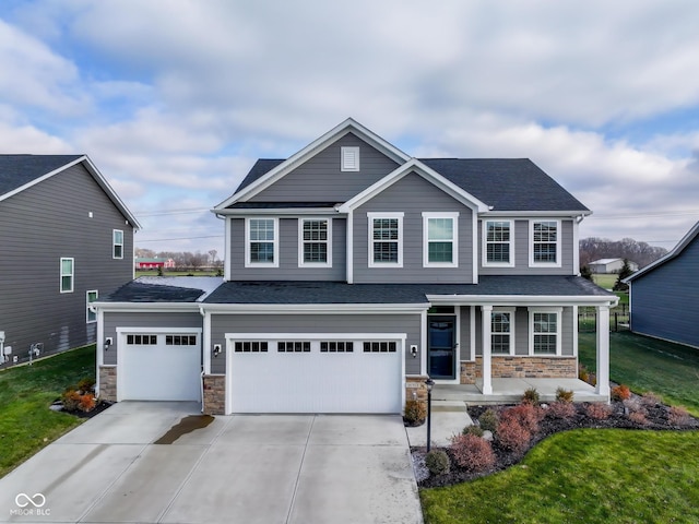 view of front of house featuring a front yard and a garage