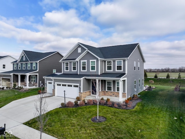 view of front of home featuring a front yard and a garage