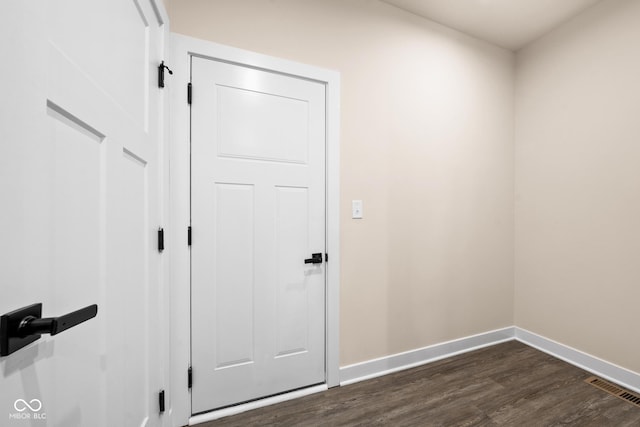 interior space with dark hardwood / wood-style flooring