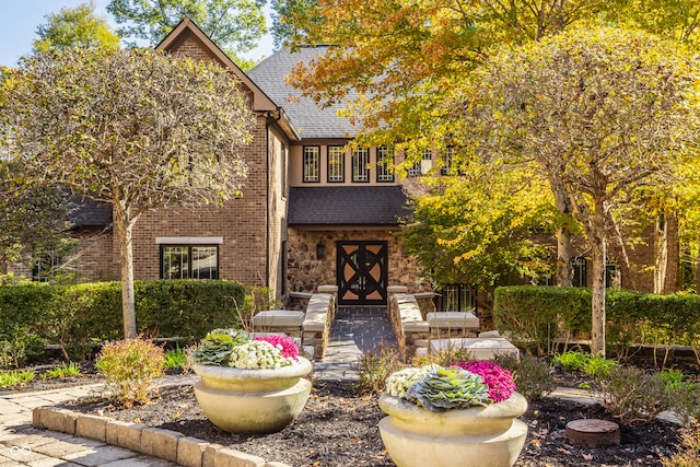 tudor-style house featuring french doors