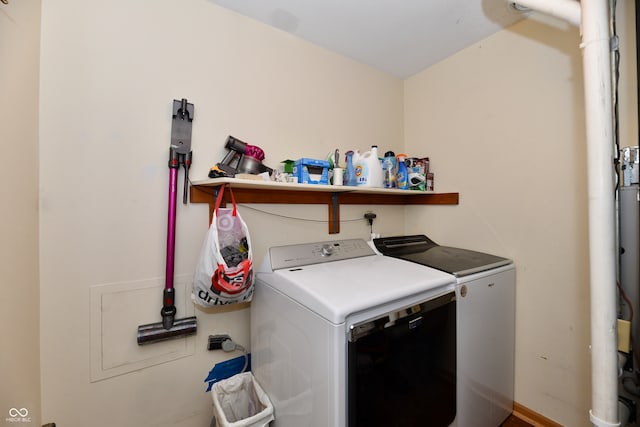 clothes washing area with independent washer and dryer