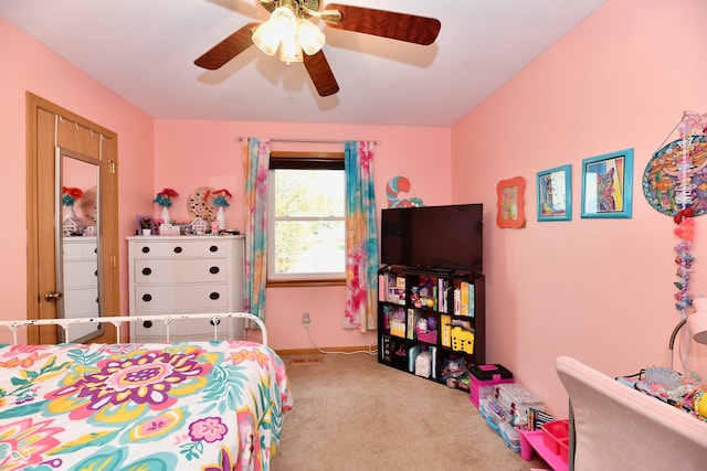 carpeted bedroom featuring ceiling fan