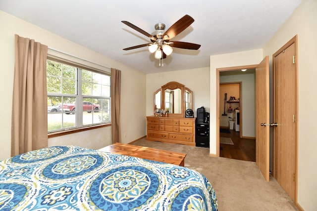 carpeted bedroom with ceiling fan