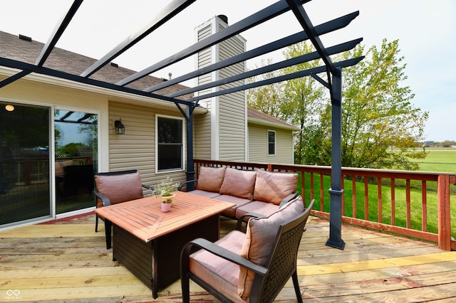 deck with outdoor lounge area, a lawn, and a pergola