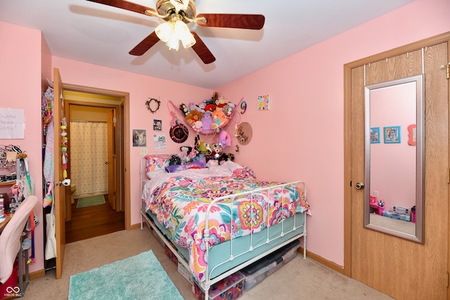 bedroom with light carpet and ceiling fan