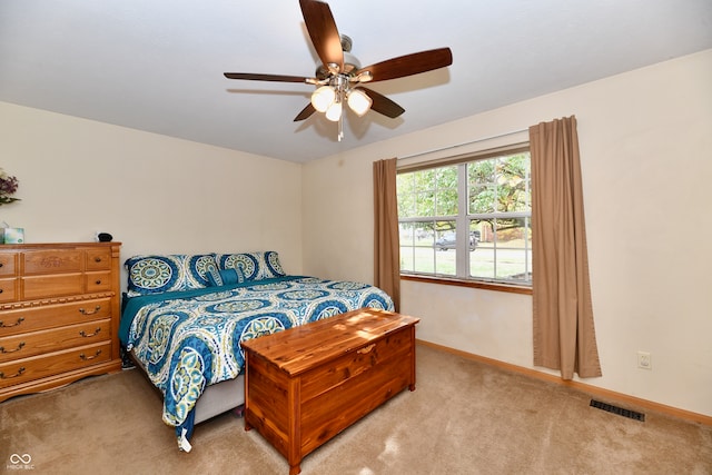 bedroom with light colored carpet and ceiling fan