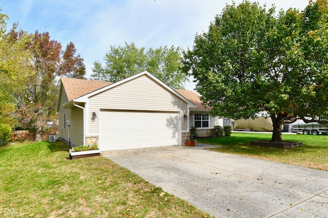 ranch-style home featuring a front lawn and a garage