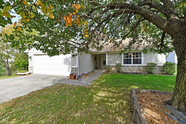 single story home with a garage and a front lawn