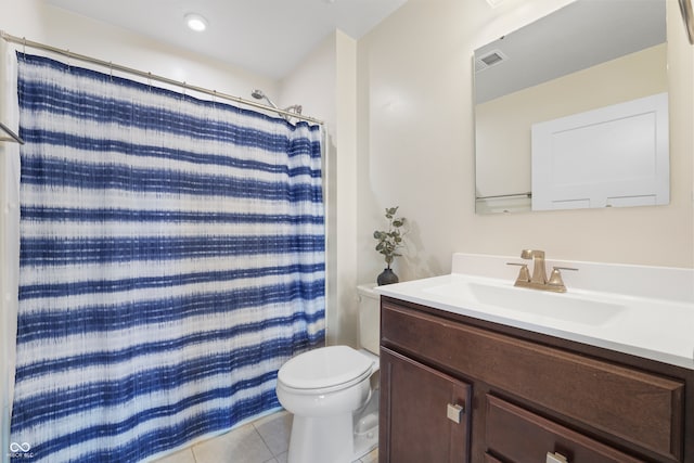 bathroom with toilet, vanity, a shower with shower curtain, and tile patterned flooring