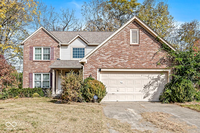 front of property featuring a front yard and a garage