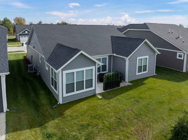 rear view of house with a lawn