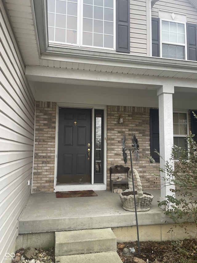 property entrance featuring covered porch