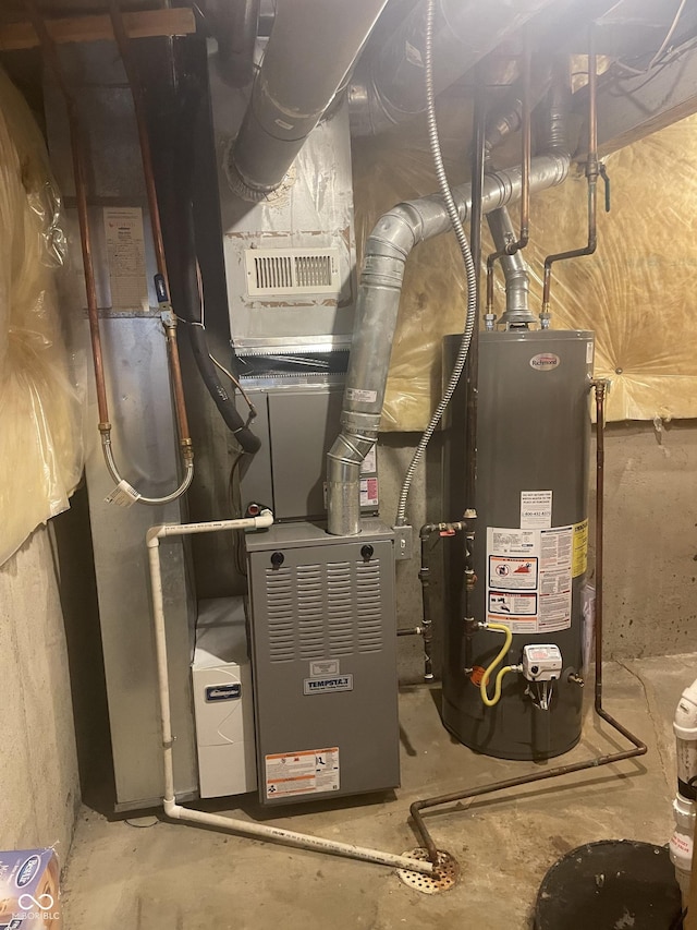 utility room featuring gas water heater and heating unit