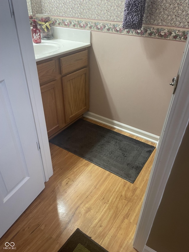 bathroom featuring vanity and wood-type flooring