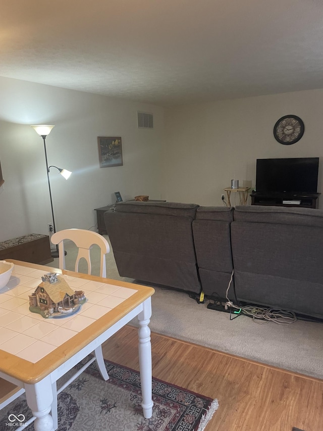 dining space featuring hardwood / wood-style floors