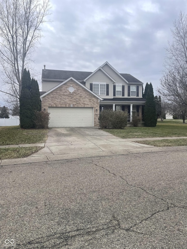 front of property with a garage and a front yard