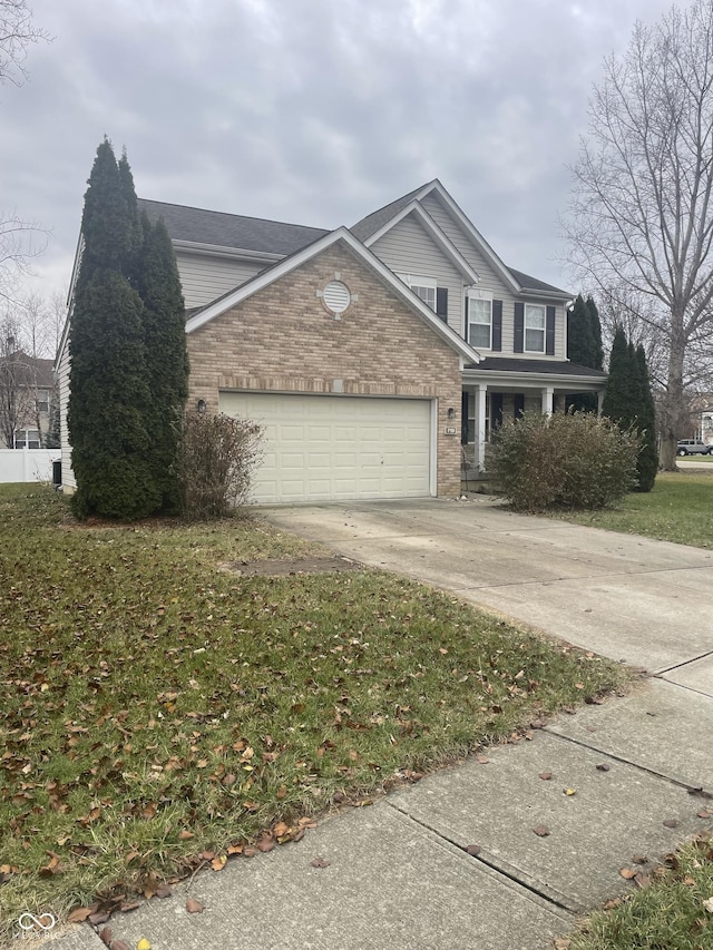 front facade with a front yard and a garage