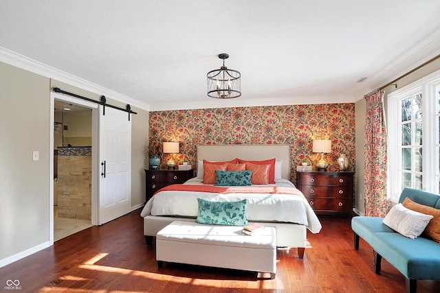 bedroom featuring ornamental molding, a barn door, a notable chandelier, and dark hardwood / wood-style flooring