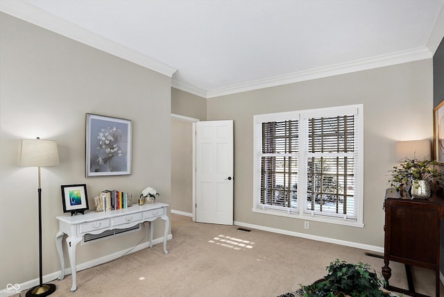 sitting room featuring light colored carpet and ornamental molding